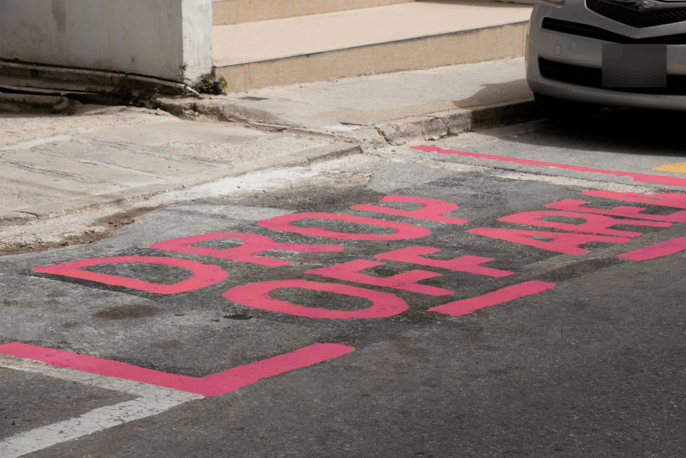 pink parking boxes to help improve parking conditions